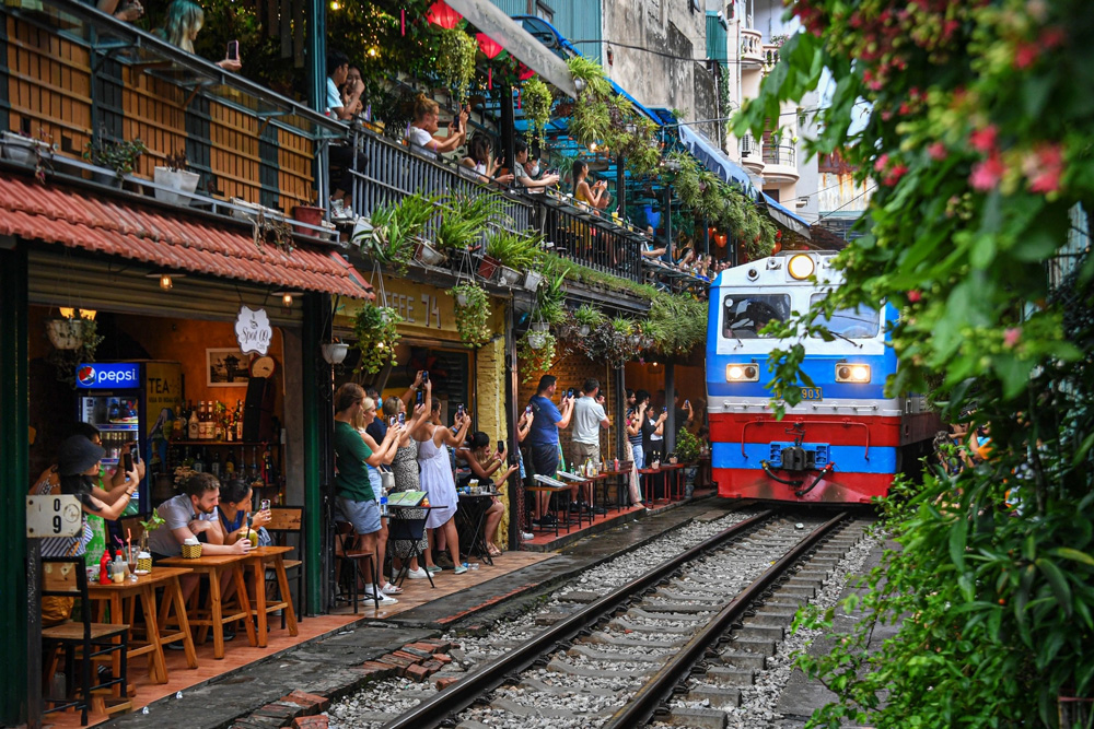 Hanoi Train Street Guide (2025): Train Schedule, Safety Tips & Best Cafes